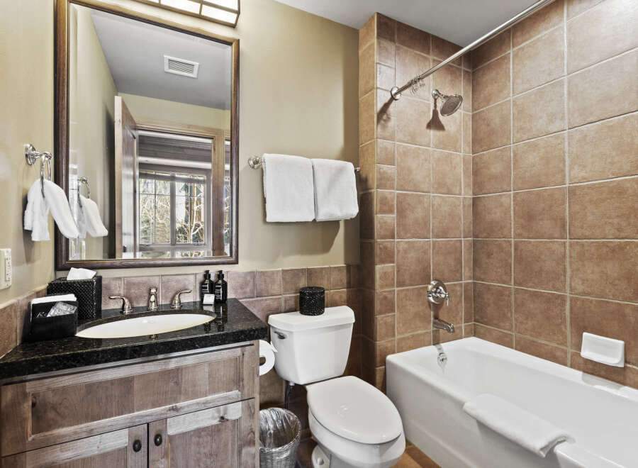 Step into luxury with this beautifully designed bathroom! Featuring a sleek vanity, a relaxing bathtub, and a separate shower area, this space is perfect for unwinding.