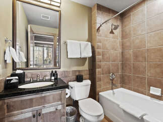 Step into luxury with this beautifully designed bathroom! Featuring a sleek vanity, a relaxing bathtub, and a separate shower area, this space is perfect for unwinding.