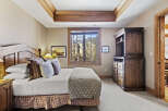 This stunning bedroom boasts a cozy and inviting atmosphere, perfect for relaxation.