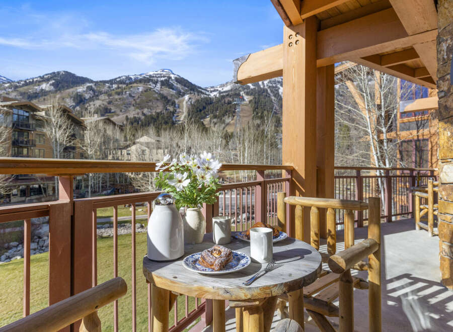 Enjoy breathtaking mountain views from this charming balcony.