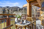 Enjoy breathtaking mountain views from this charming balcony.