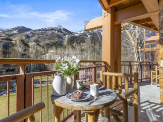Enjoy breathtaking mountain views from this charming balcony.