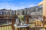Enjoy breathtaking mountain views from this charming balcony.