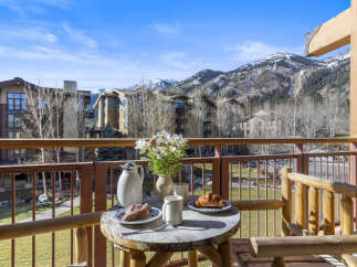 Enjoy breathtaking mountain views from this charming balcony.