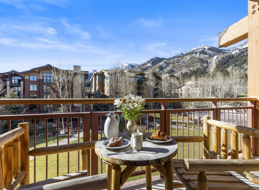 Enjoy breathtaking mountain views from this charming balcony.