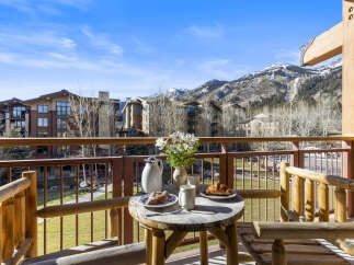 Enjoy breathtaking mountain views from this charming balcony.