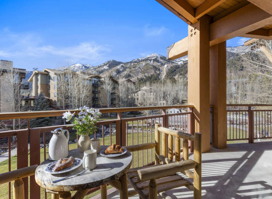 Enjoy breathtaking mountain views from this charming balcony.