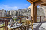 Enjoy breathtaking mountain views from this charming balcony.