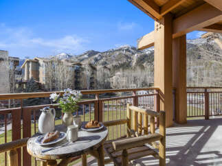 Enjoy breathtaking mountain views from this charming balcony.