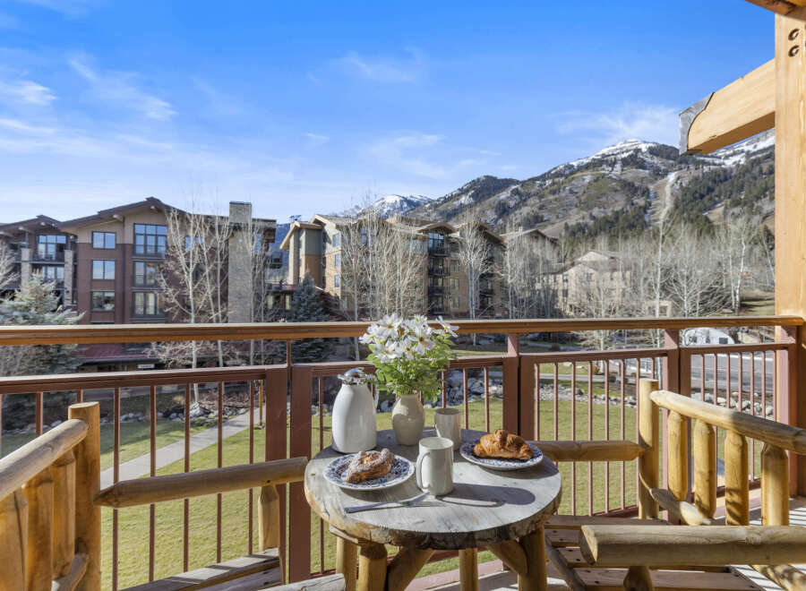 Enjoy breathtaking mountain views from this stunning balcony.