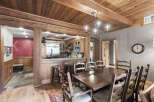 Step into a rustic dining room that exudes warmth and charm.