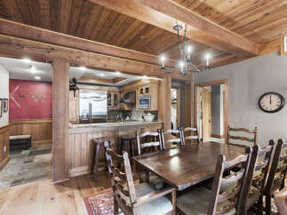 Step into a rustic dining room that exudes warmth and charm.