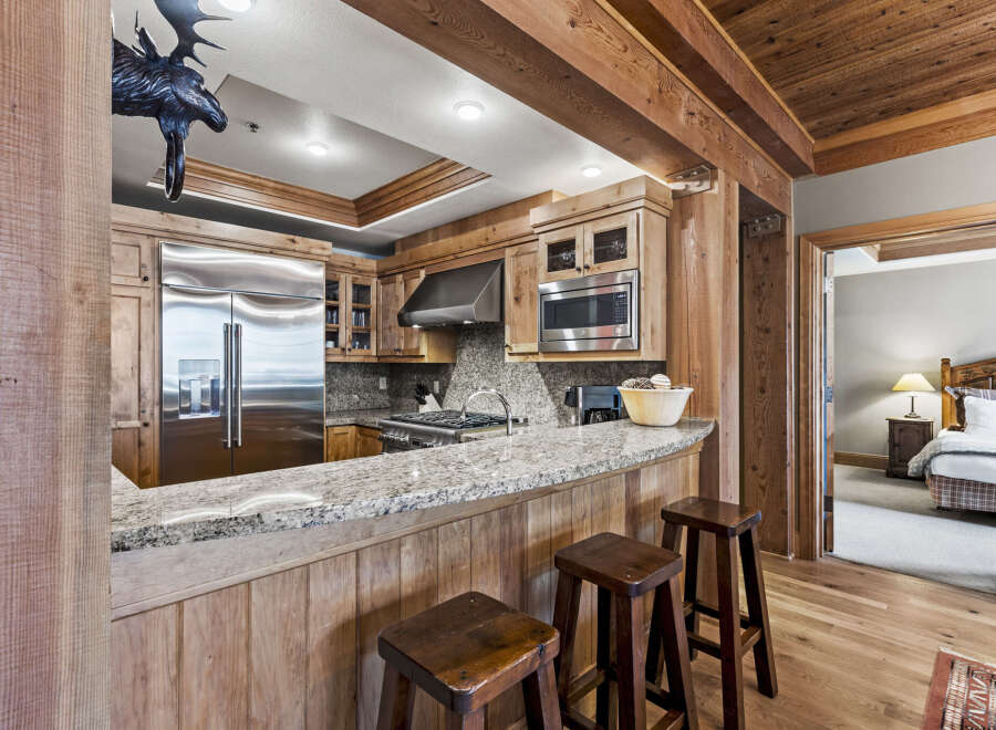 This stunning kitchen boasts a rustic yet modern design, perfect for entertaining and everyday living.