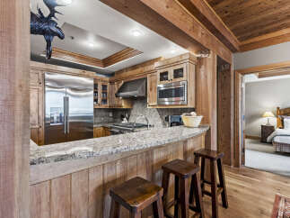 This stunning kitchen boasts a rustic yet modern design, perfect for entertaining and everyday living.