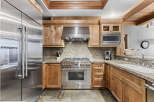 This stunning kitchen boasts high-end appliances and custom cabinetry, perfect for the discerning chef.