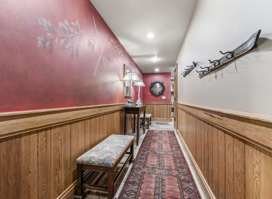 Step into this inviting hallway, showcasing a blend of rustic charm and elegant design.