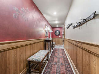 Step into this inviting hallway, showcasing a blend of rustic charm and elegant design.