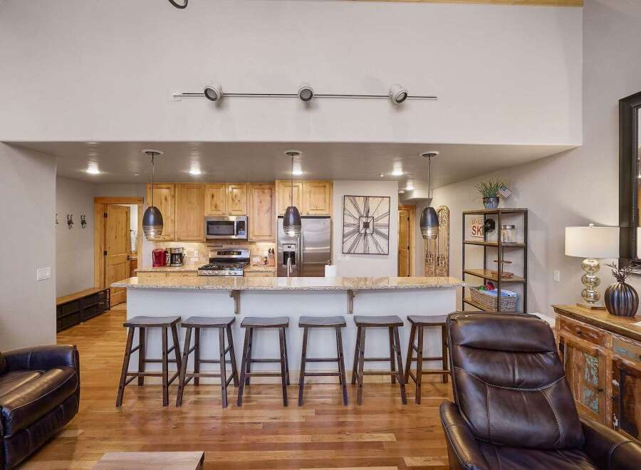 This stunning property boasts a modern kitchen with granite countertops and stainless steel appliances, perfect for culinary enthusiasts.