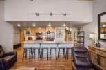 This stunning property boasts a modern kitchen with granite countertops and stainless steel appliances, perfect for culinary enthusiasts.