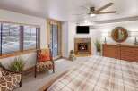 Experience luxury in this stunning bedroom featuring a cozy fireplace, perfect for those chilly evenings.