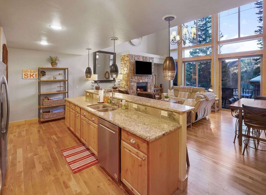 This stunning property boasts a spacious open-concept kitchen with granite countertops and modern appliances, perfect for culinary enthusiasts.