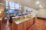 Experience luxury living in this stunning property featuring a gourmet kitchen with granite countertops and stainless steel appliances.