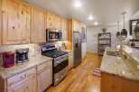 This stunning kitchen boasts beautiful wooden cabinetry, offering ample storage and a warm, inviting atmosphere.