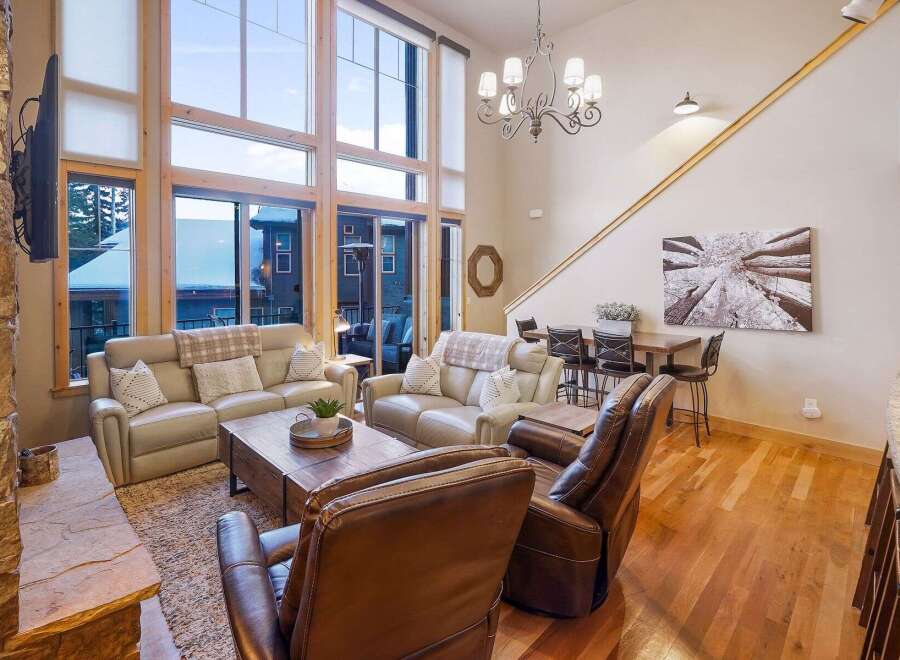 Experience luxury living in this stunning property, boasting an open-concept design with soaring ceilings and expansive windows that flood the space with natural light.