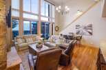 Experience luxury living in this stunning property, boasting an open-concept design with soaring ceilings and expansive windows that flood the space with natural light.