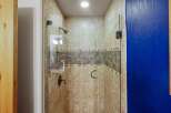 Step into a beautifully designed bathroom with a modern shower.