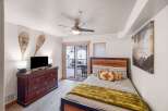 This cozy bedroom offers a serene retreat with its inviting ambiance and stylish decor.