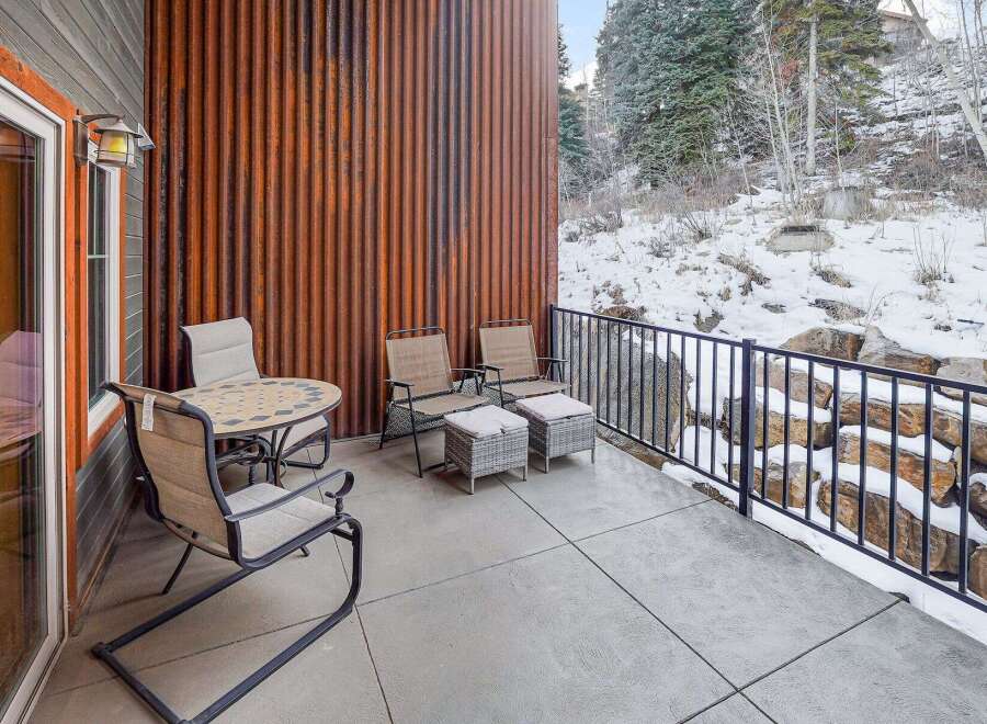 Enjoy the serene beauty of this property with its inviting outdoor patio space.