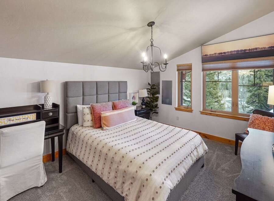 This stunning bedroom offers a serene retreat with its elegant design and inviting ambiance.