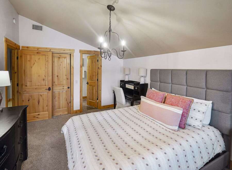 This stunning bedroom boasts a cozy and inviting atmosphere, perfect for relaxation.