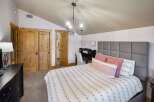 This stunning bedroom boasts a cozy and inviting atmosphere, perfect for relaxation.