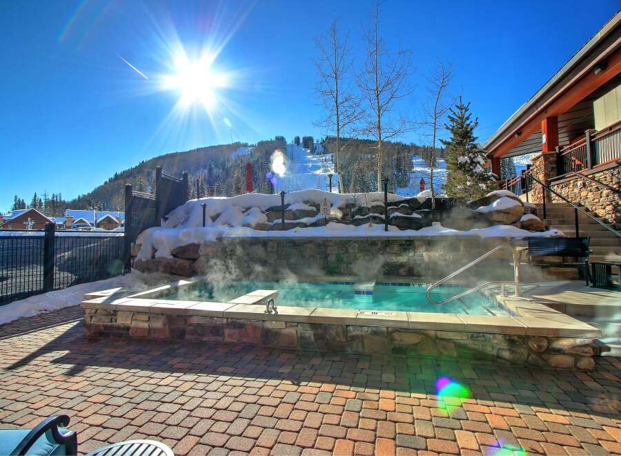 Enjoy the ultimate relaxation experience at this luxurious property, featuring a stunning outdoor hot tub.