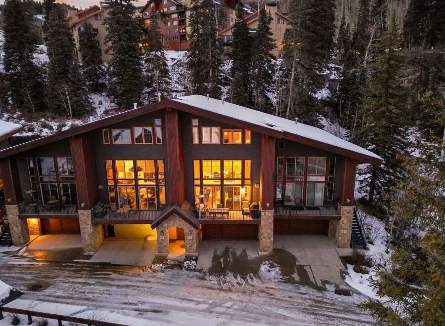 Discover luxury living in this stunning mountain home, featuring expansive windows that showcase breathtaking views and flood the interior with natural light.