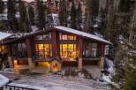 Discover luxury living in this stunning mountain home, featuring expansive windows that showcase breathtaking views and flood the interior with natural light.