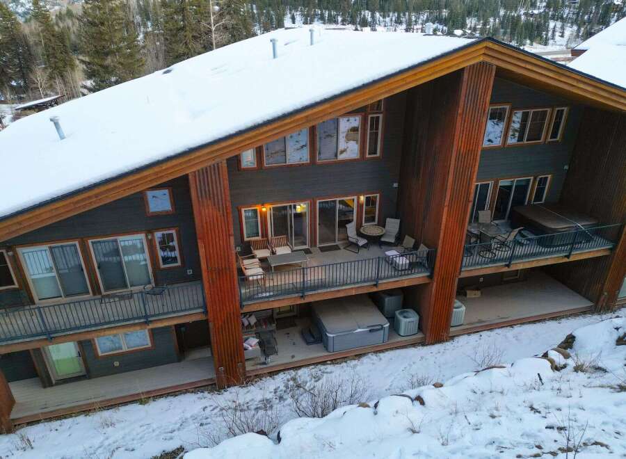 This stunning mountain home offers luxurious living with breathtaking views.