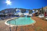 Enjoy the ultimate winter getaway at this stunning property! Featuring a heated outdoor pool with a waterslide, perfect for relaxing after a day on the slopes.