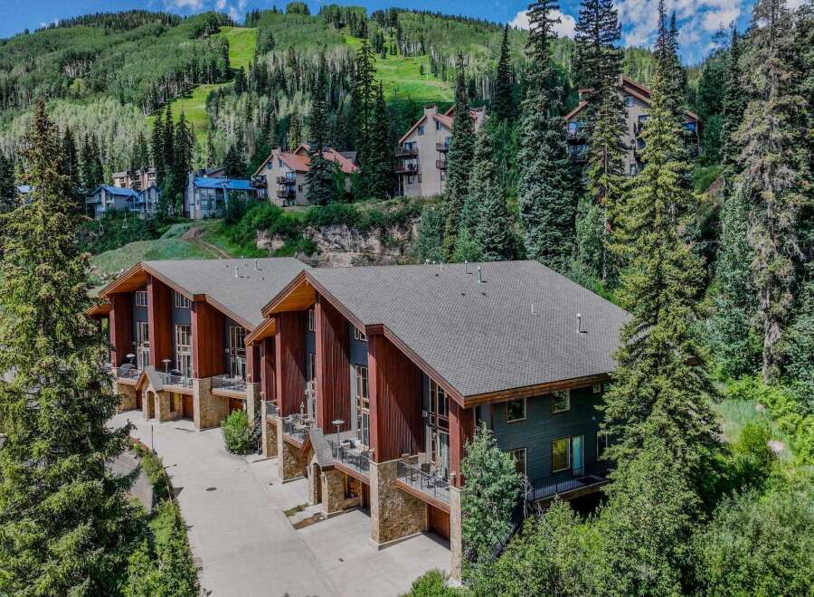 Experience luxury mountain living in this stunning property, nestled amidst lush greenery and offering breathtaking views of the ski slopes.