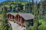 Experience luxury mountain living in this stunning property, nestled amidst lush greenery and offering breathtaking views of the ski slopes.