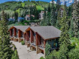 Experience luxury mountain living in this stunning property, nestled amidst lush greenery and offering breathtaking views of the ski slopes.