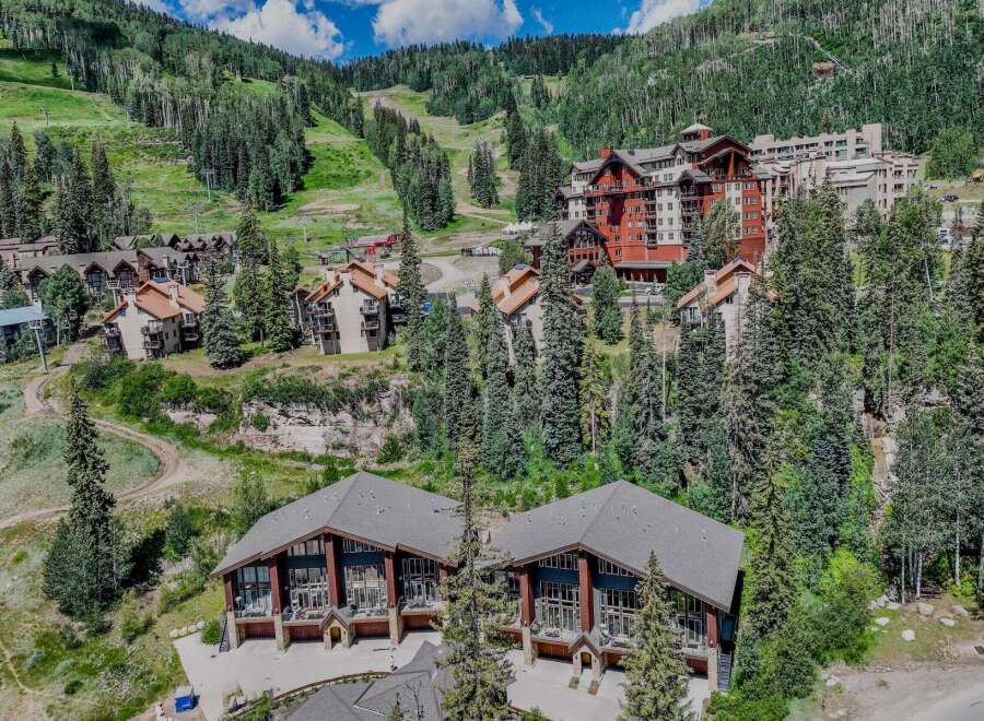 Experience luxury mountain living in this stunning property nestled amidst a picturesque ski resort.