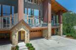 Experience luxury mountain living in this stunning modern home, featuring expansive windows that capture breathtaking natural light and scenic views.