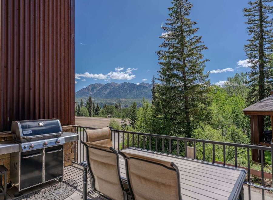 Enjoy breathtaking mountain views from this stunning balcony, complete with a premium grill for outdoor cooking.