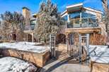 This stunning property boasts a beautiful exterior with stone accents and a modern design.