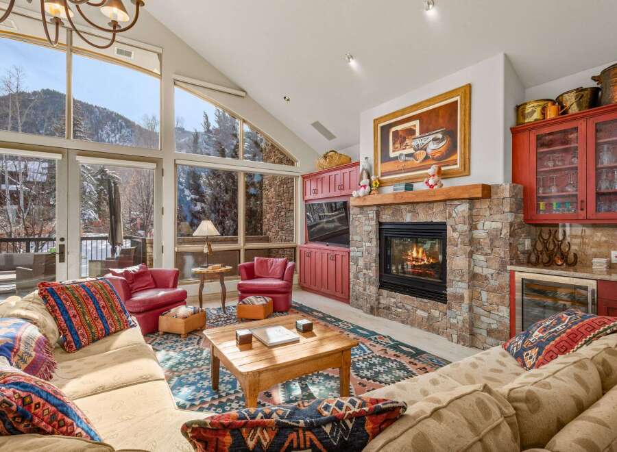 This stunning living room boasts a cozy fireplace, perfect for chilly evenings.