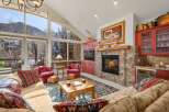 This stunning living room boasts a cozy fireplace, perfect for chilly evenings.