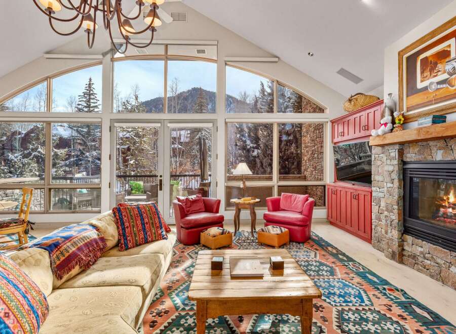 Experience the epitome of luxury living in this stunning property, boasting breathtaking mountain views through expansive windows.